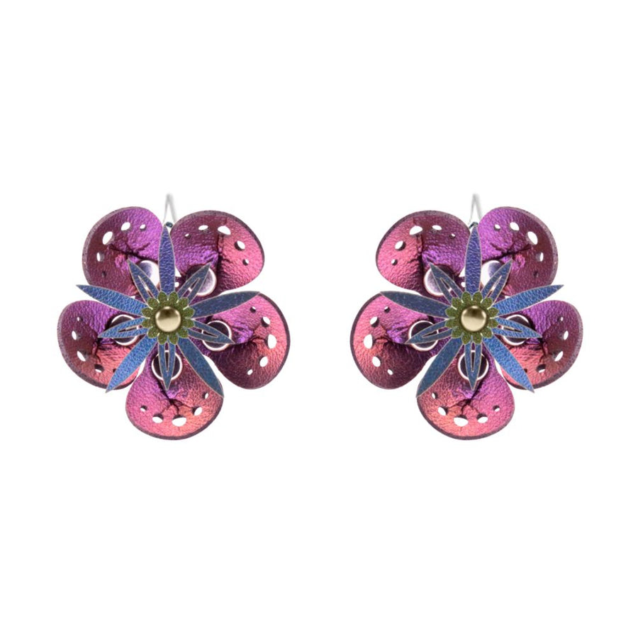 Large earrings with a purple iridescent flower and blue iridescent stamen, shown on a white background