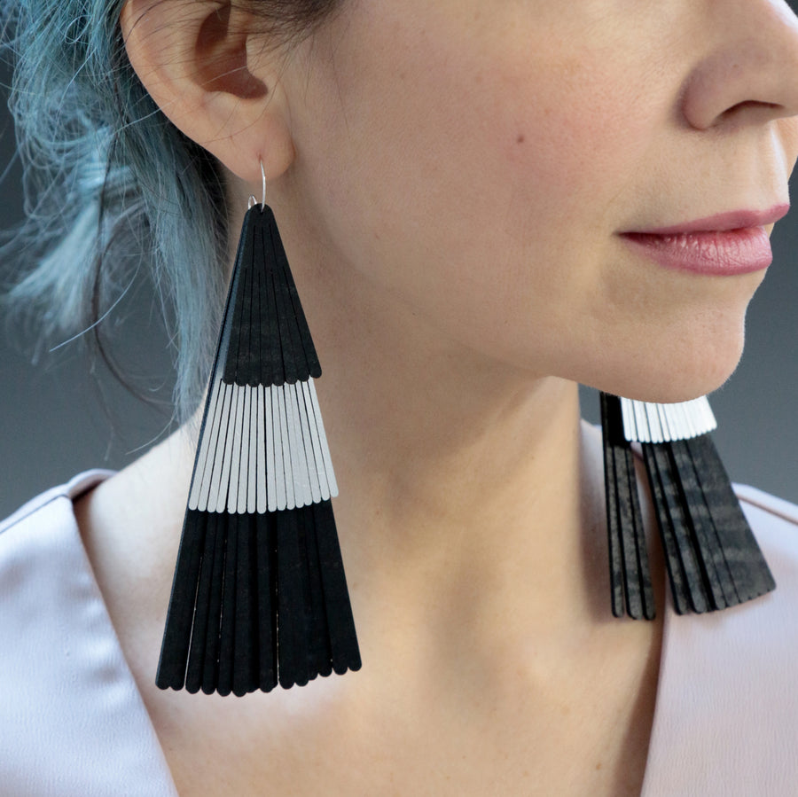 Three tier fringe fan earrings made with black and silver vegan leather.  