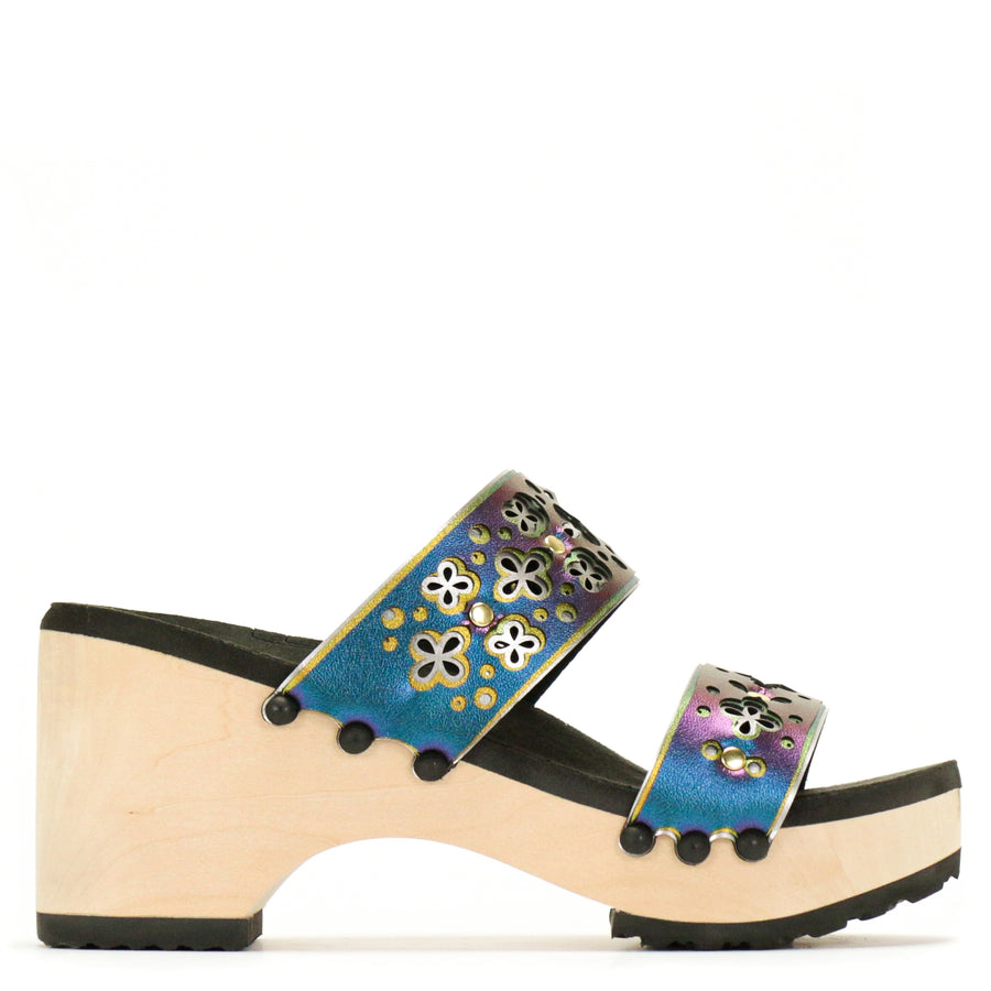 Side view of a iridescent blue laser cut sandal with multiple layers