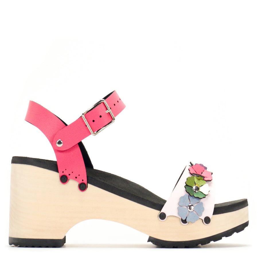 Side view of a sandal with7 simple colorful flowers and a hot pink ankle strap
