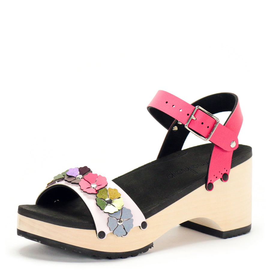 3/4 view of a sandal with7 simple colorful flowers and a hot pink ankle strap