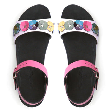 Top view of a sandal with7 simple colorful flowers and a hot pink ankle strap