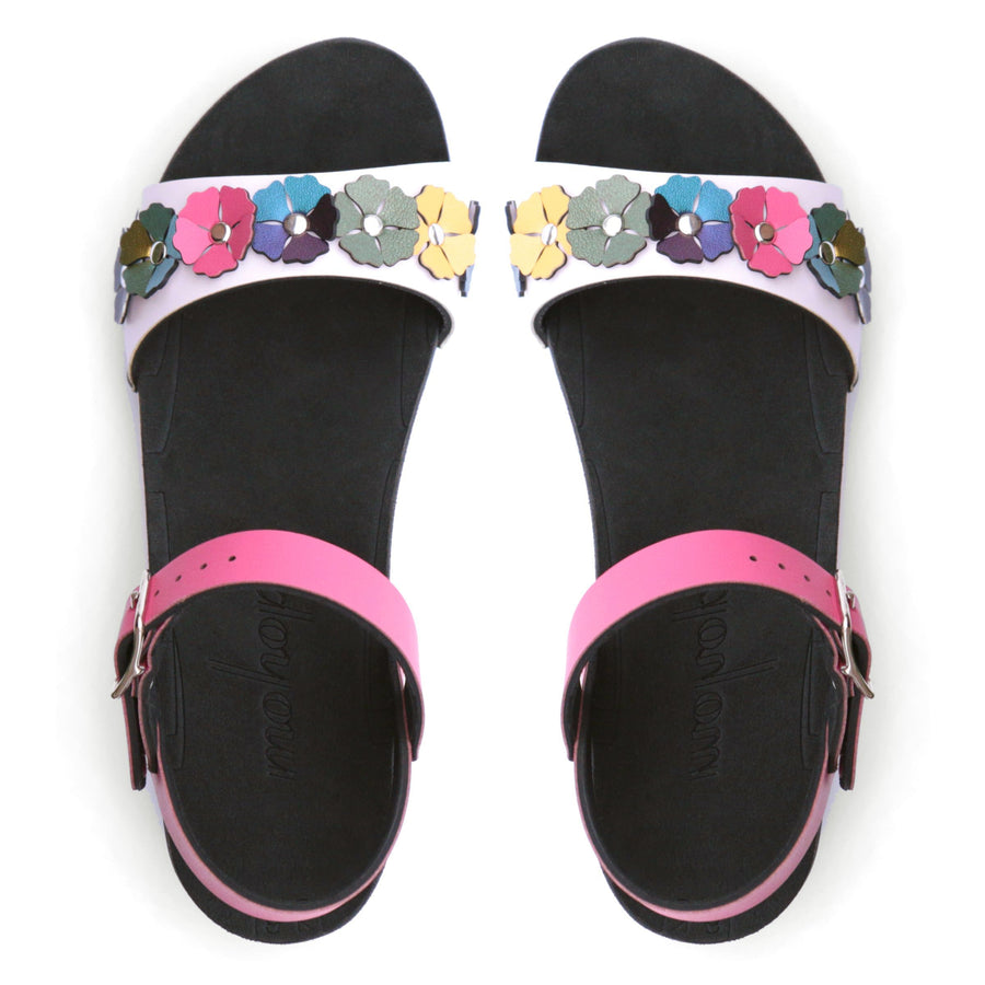 Top view of a sandal with7 simple colorful flowers and a hot pink ankle strap