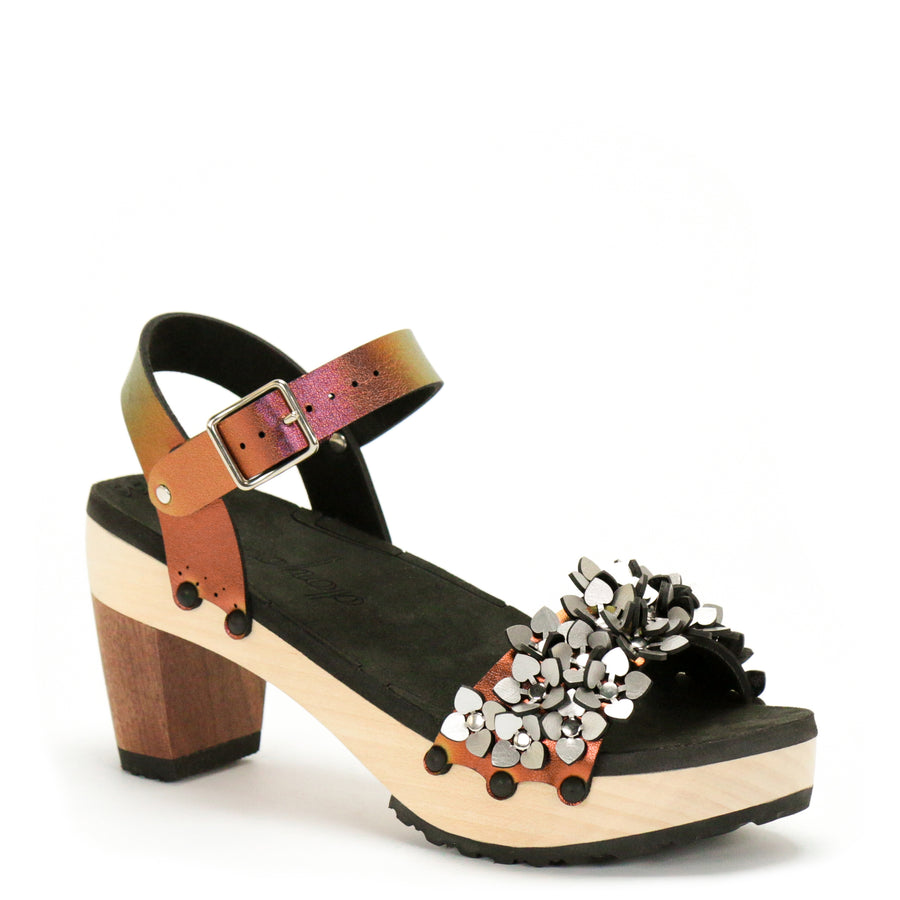 3/4 view of a sandal with a silver sparkly toe and red adjustable ankle strap