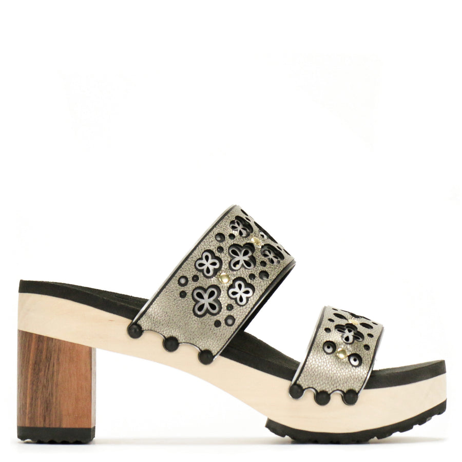 Outside view of a sandal with a gold and silver laser cut upper