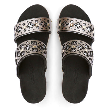 Top view of a sandal with a gold and silver laser cut upper