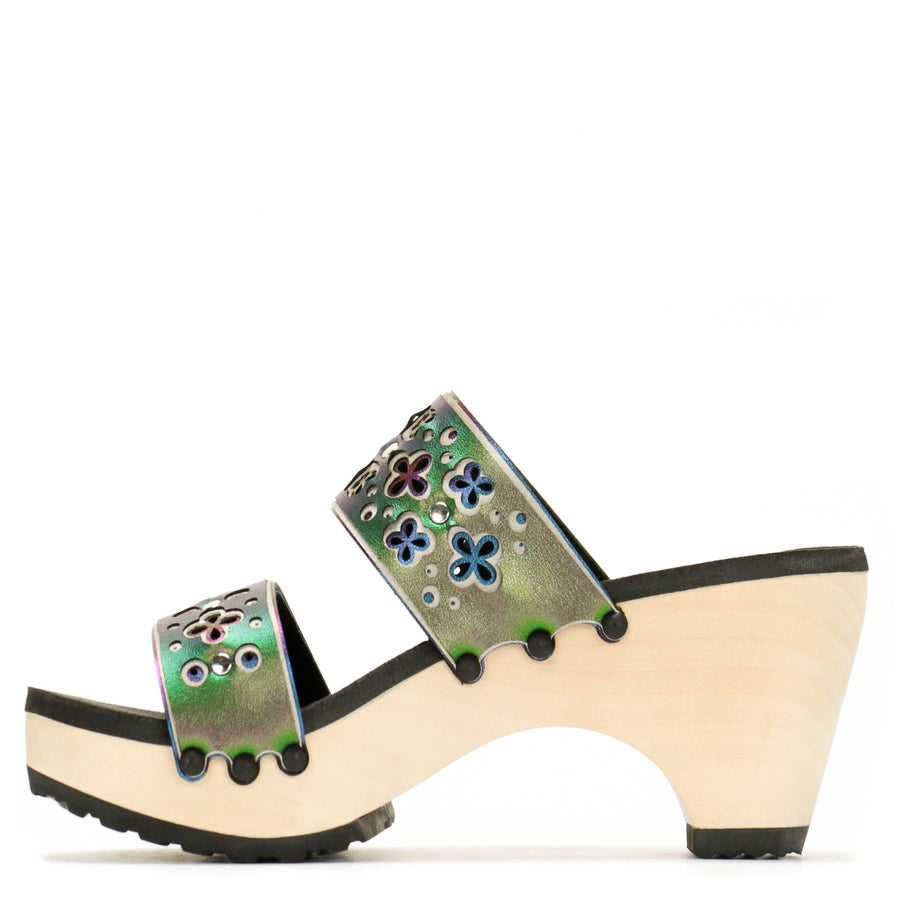 Inside view of a sandal with layers of laser cut material in greens and blues