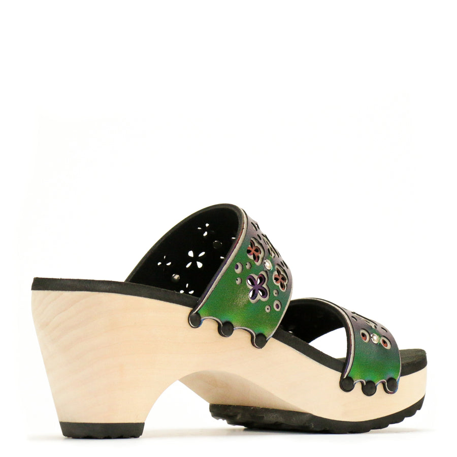 Back view of a sandal with layers of laser cut material in greens and blues