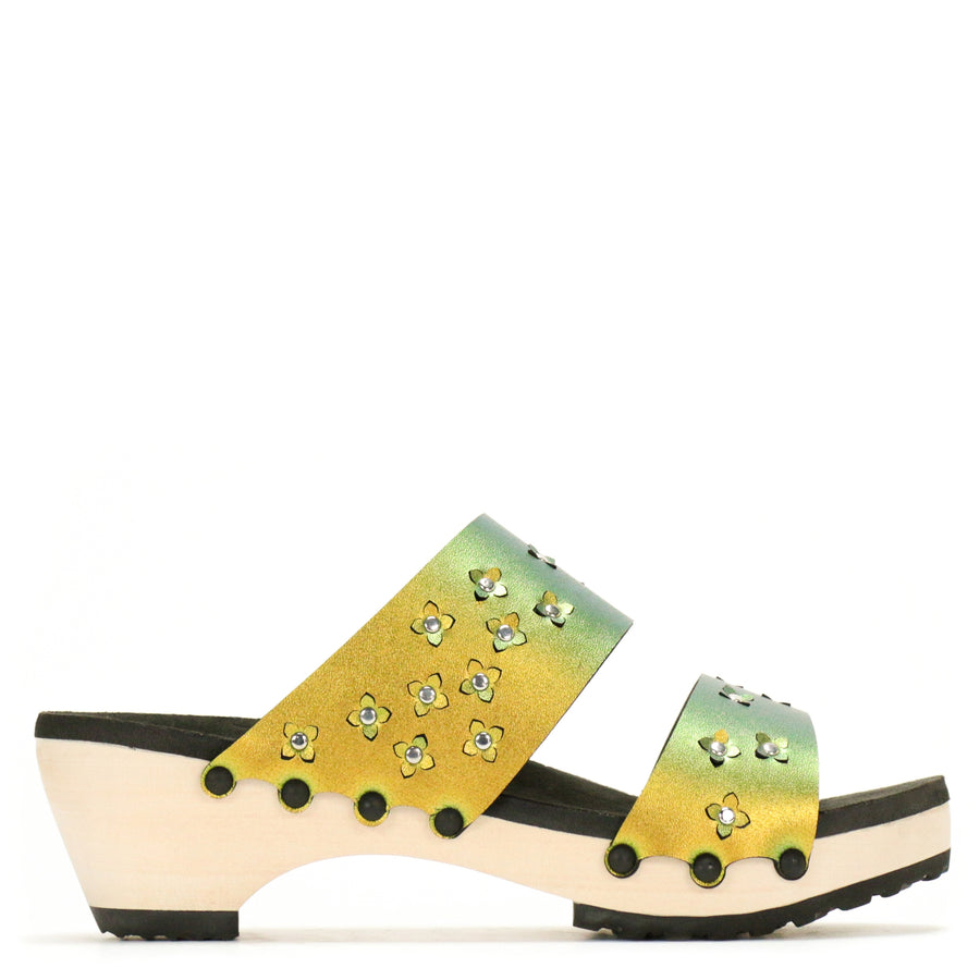 Side view of sandals in iridescent gold with tiny laser cut flowers sprinkled on the upper