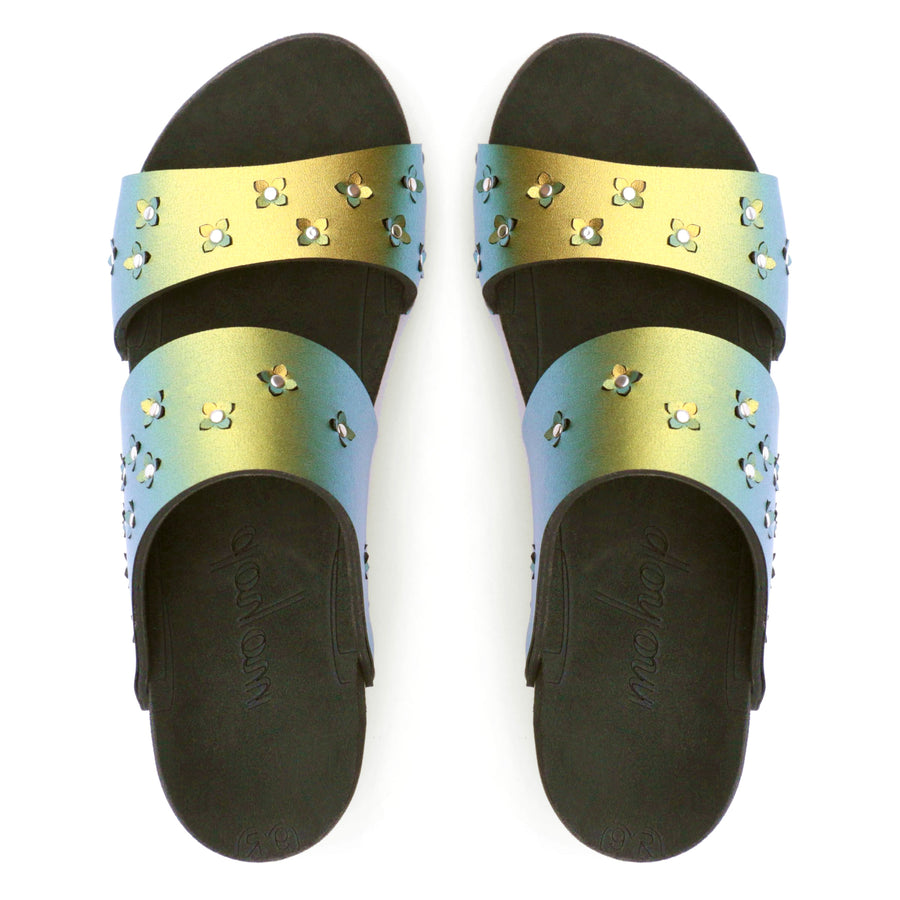 Top view of sandals in iridescent gold with tiny laser cut flowers sprinkled on the upper