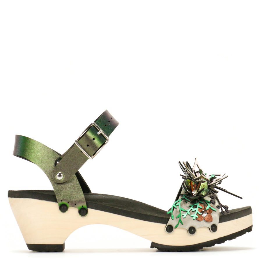 Side view of sandals with a a 3D laser cut floral motif in a rainbow of colors