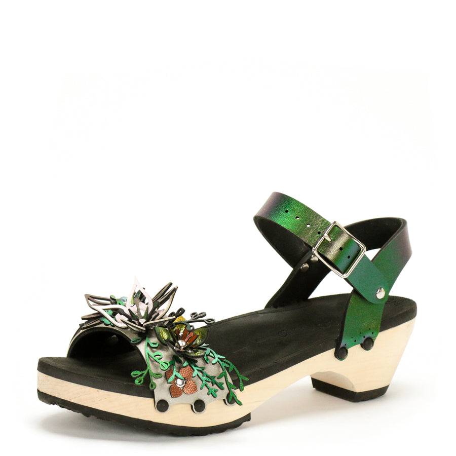 3/4 view of sandals with a a 3D laser cut floral motif in a rainbow of colors