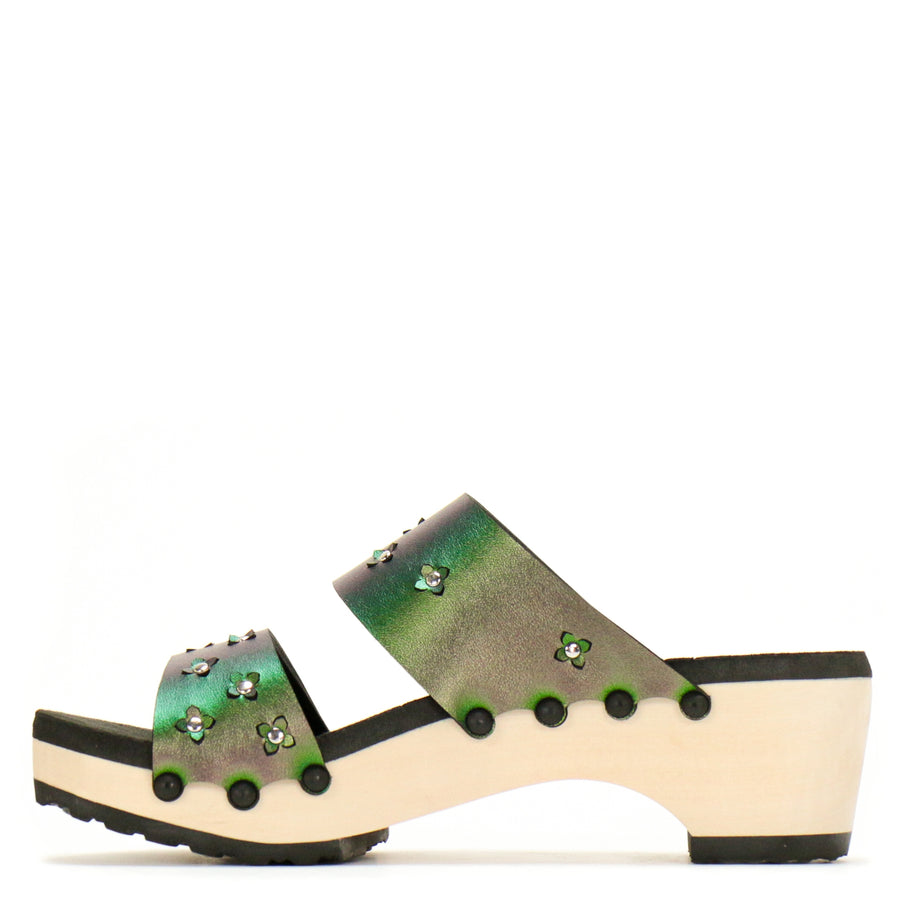 Inside view of sandals in iridescent green with tiny laser cut flowers sprinkled on the upper