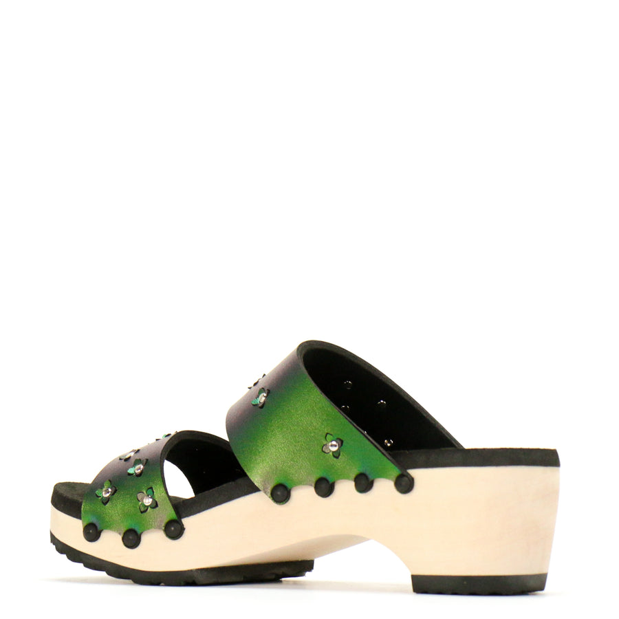 Back view of sandals in iridescent green with tiny laser cut flowers sprinkled on the upper