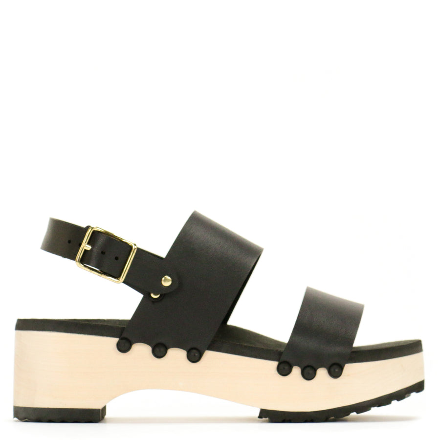 Side view of a sandal with wide chunky straps in matte black