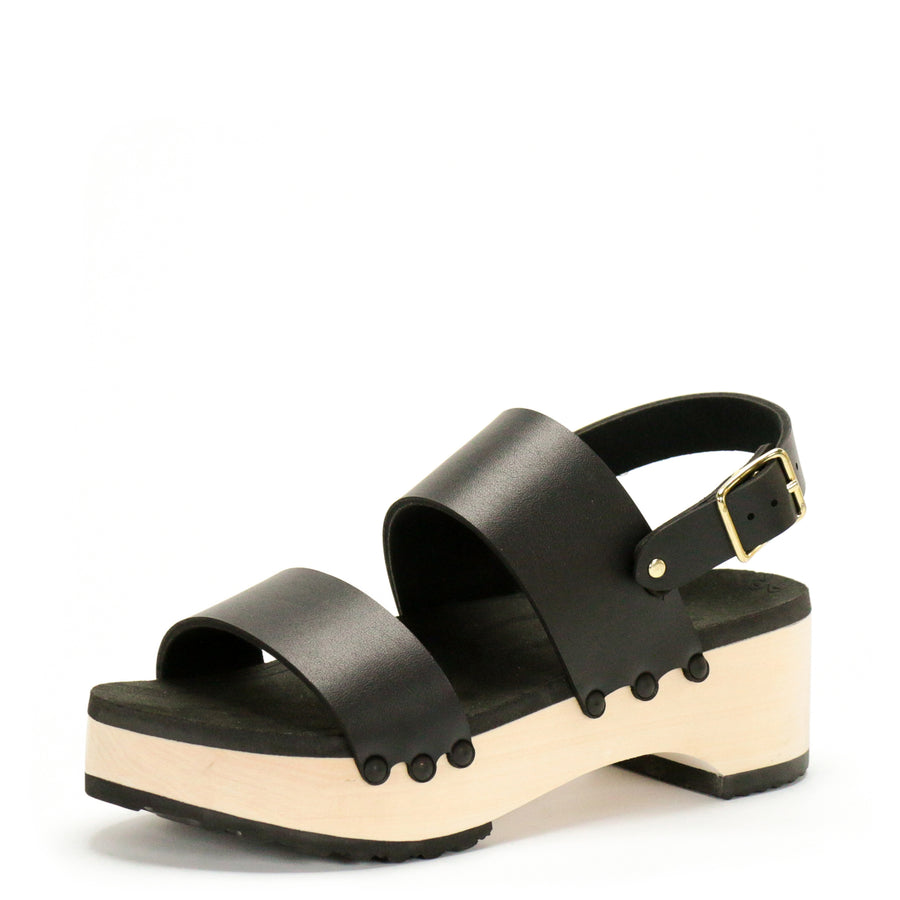 3/4 view of a sandal with wide chunky straps in matte black