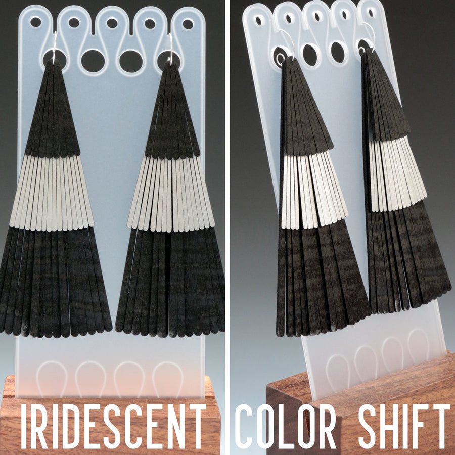 Color shifting iridescent fan fringe earrings. Made with black and silver vegan leathers.