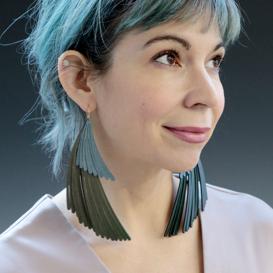 Two tier wing fringe earrings. Made in Chicago using emerald and turquoise iridescent vegan leather.
