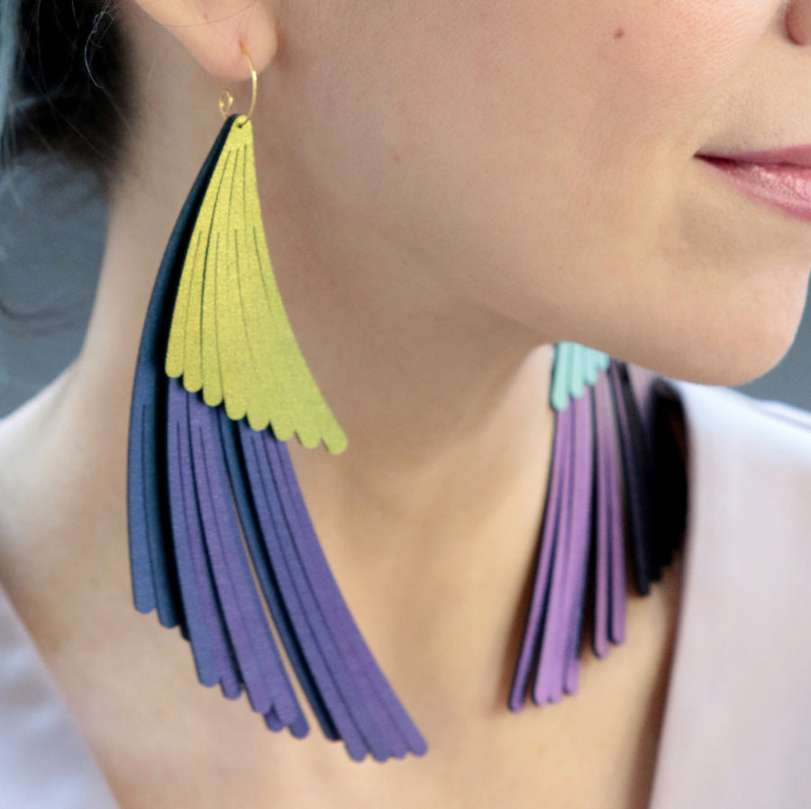 Two tier wing fringe earrings. Made in Chicago using chameleon and scarab iridescent vegan leather.