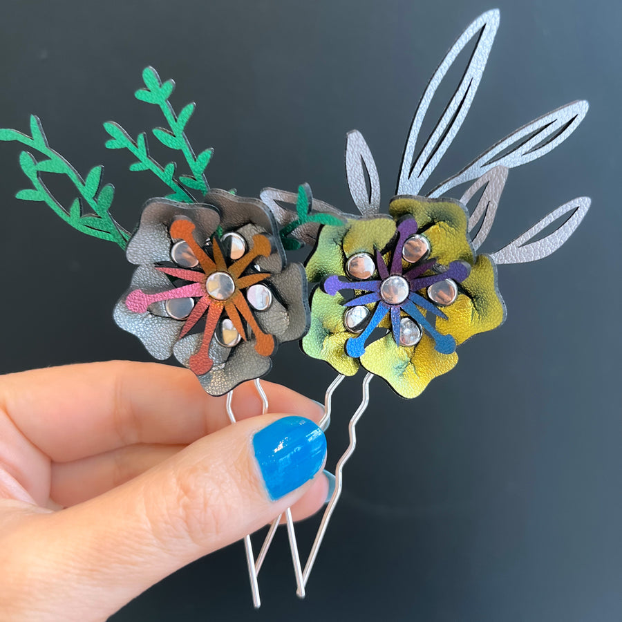 A pair of hairpins with 3D flowers