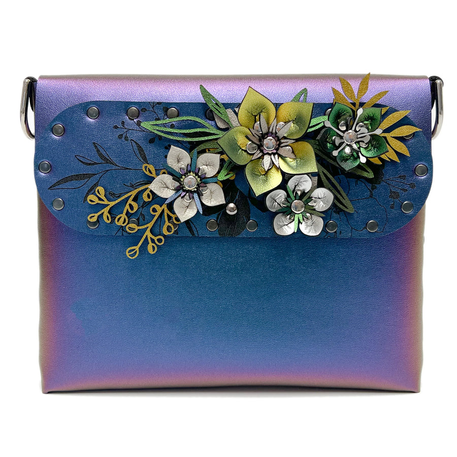 Peacock iridescent handbag with floral design.