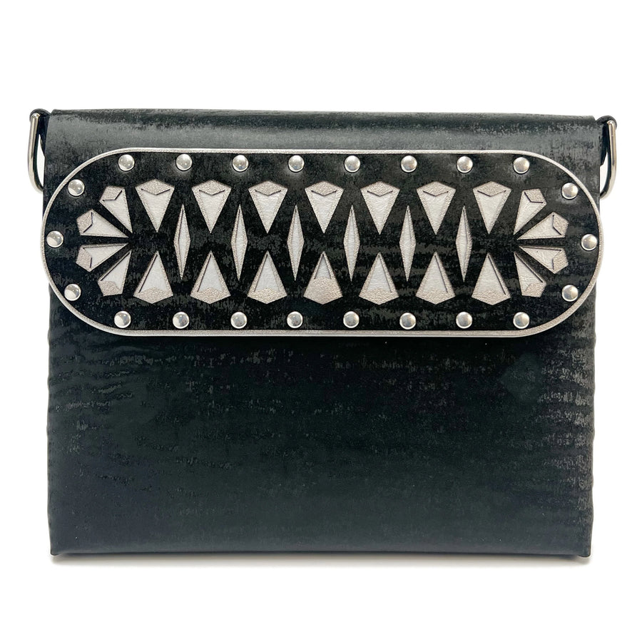 Black Chinchilla Square Arrow Bag hand riveted from laser cut vegan leather. 