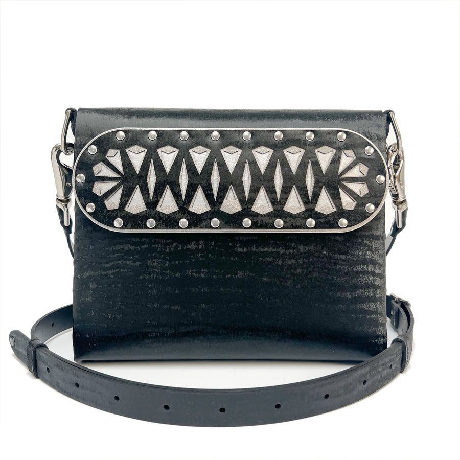 Black Chinchilla Square Arrow Bag with laser cut arrow motif.  Styled with adjustable crossbody strap.